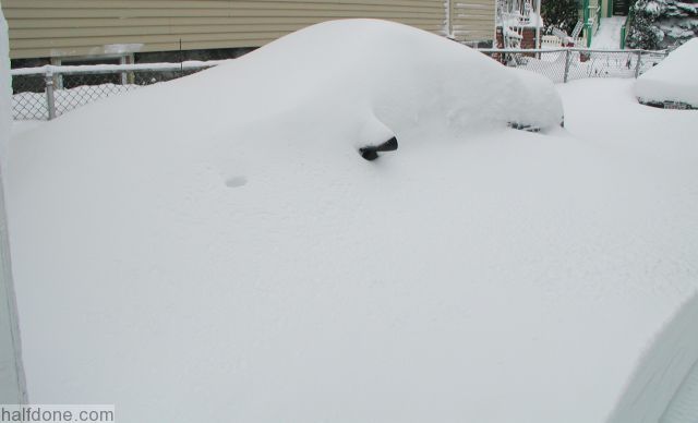 Car completely covered in snow